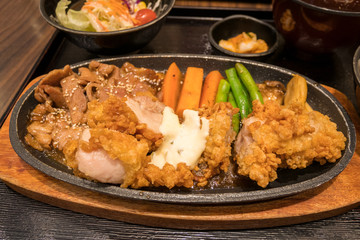 japanese style fried chicken and pork on plate