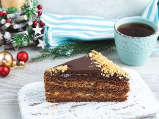 sponge cake with nuts and chocolate, caramel layers