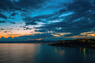 Dramatic sunset over the coastline after a thunderstorm. Nature of Spain, Cape Salou