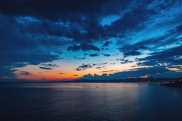 Dramatic sunset over the coastline after a thunderstorm. Nature of Spain, Cape Salou