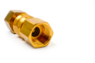 Close-up pneumatic quick coupling made of high-quality yellow metal, close-up shot on a white background