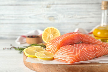 Fresh raw salmon with lemon on table. Fish delicacy
