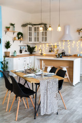 Table setting with holiday decorations. Preparation for christmas dinner