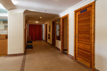 interior of the modern Spa center with hall, tables, chairs, corridors, beautiful design of dark wood. Europe Greece