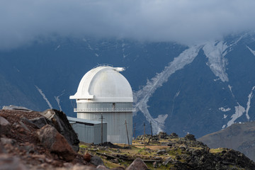 Obraz premium the old Observatory on the background of rocky mountains with snow. The Caucasus. Russia.
