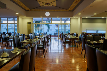 large empty dining room of all inclusive resort restaurant, Europe, Greece.