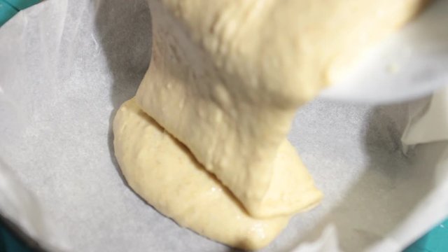 Close-up, cake dough casting on baking sheet