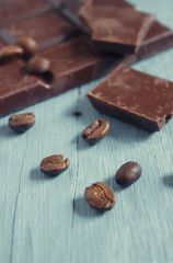 chocolate and coffee beans on wooden table
