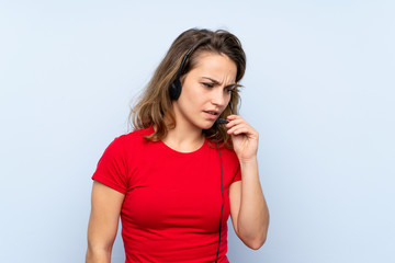 Young blonde woman working with headset