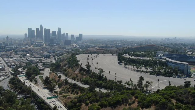 Los Angeles Downtown Skyline From Dodger Stadium Hill Aerial Shot Backward