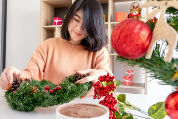 young asian woman prepare decorating for christmas and new year celebration