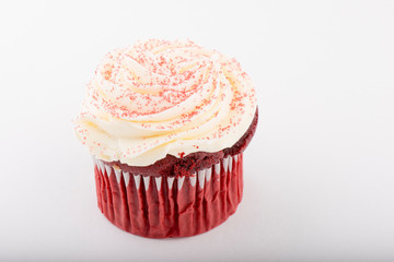 Red Velvet Cupcake with Pink Frosting and Sprinkles