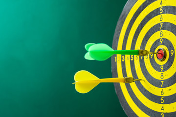 Target for playing darts on a green background