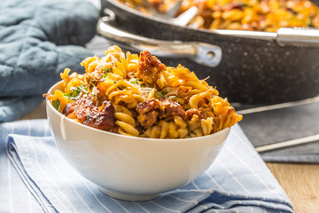 Baked pasta fusilli with smoked pork neck mozzarela cheese and othe ingredients