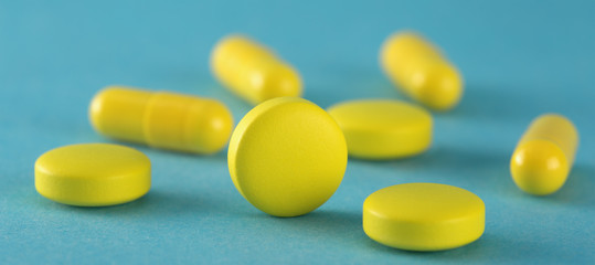 Medical pills are yellow in color. Images for the pharmaceutical industry. The concept of medicine.