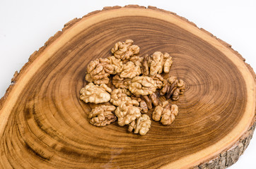 Walnut kernels on wooden slab