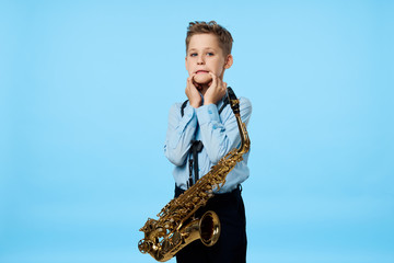 Fototapeta premium young man with a saxophone