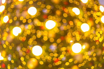 Yellow Colorful light Abstract circular bokeh of Christmas tree background Decoration During...