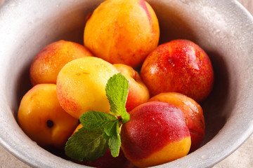 juicy fresh ripe peaches in a metal plate
