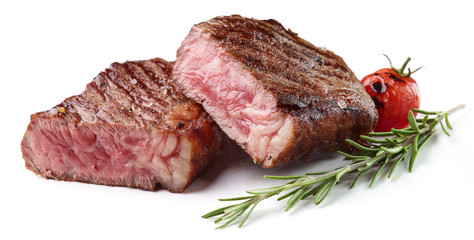 Sliced Grilled Beef Steak with rosemary and tomato Isolated on white background
