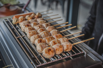 Thai meatball and pork sausage with vegetables cabbage and ginger