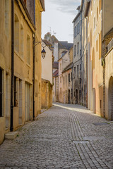 Fototapeta na wymiar Medieval Street in the city of Dole in the Jura department in the Franche-Comté region in eastern France.