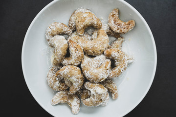 Homemade cookies on plate over dark background. Top view.