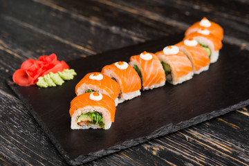 Delicious rolls with fish and cheese	