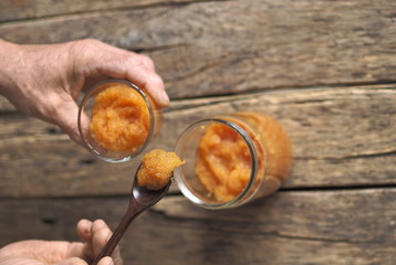 river fish caviar on a wooden ancient brown background