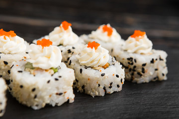 Delicious rolls with fish and cheese	