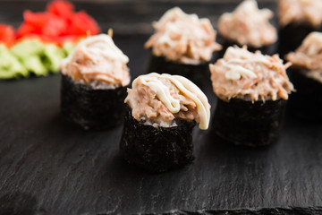 Delicious rolls with fish and cheese	