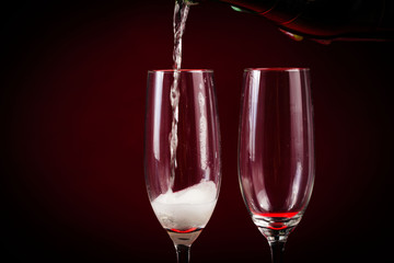 Drink. Two glasses white wine, dark background