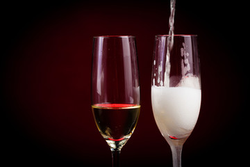 Drink. Two glasses white wine, dark background
