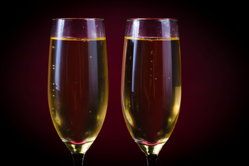 Drink. Two glasses white wine, dark background