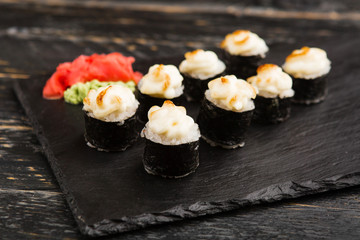 Delicious rolls with fish and cheese	