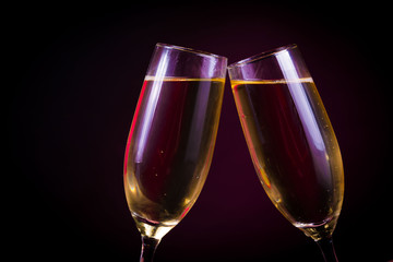 Drink. Two glasses white wine, dark background