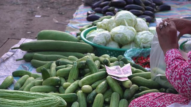 Woman Selling Vegetable on a Street