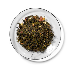 Green tea with aromatic additives. Top view on white background