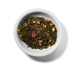 Green tea with aromatic additives. Top view on white background