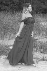 Woman in long dress on beach