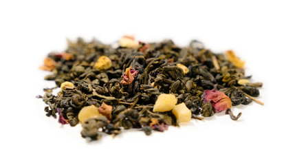 Green tea with aromatic additives. Top view on white background
