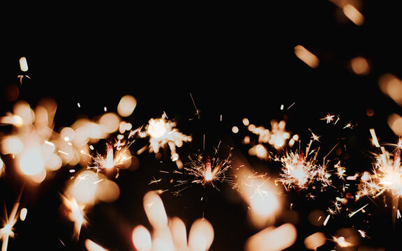  Sparklers On A Black Background Isolated Copy Space.