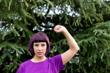 Woman with her fist held high