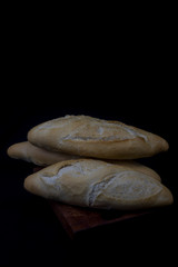 wheat crusty bread on wooden boards
