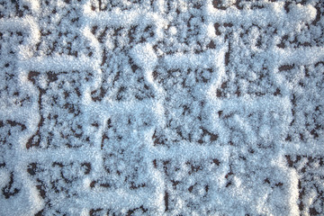 Gray stone tiles in the snow