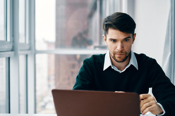 young man working on laptop
