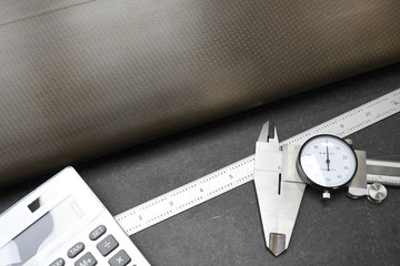 Calculator calipers and ruler used in quality assuarnce operations at business that need strict measurments