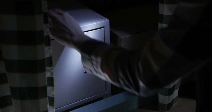 Cinematic. The woman is a robber casing the house at night and finds a safe