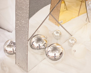 beautiful silver and gold christmas balls on a silver background