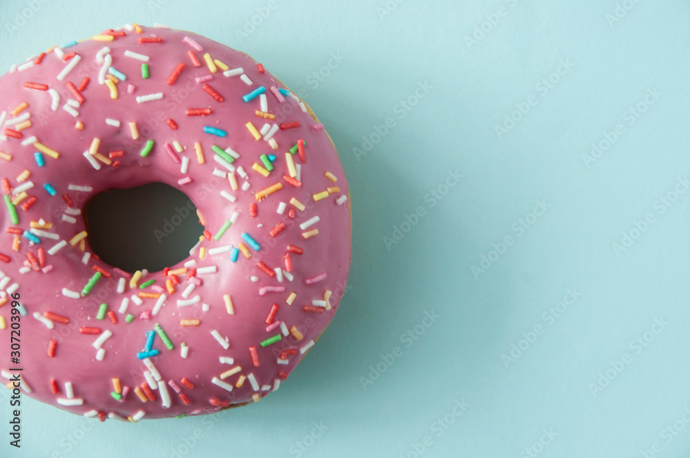 Poster one pink sweet doughnut with blue background